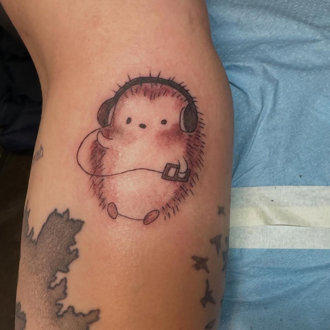 Adorable hedgehog tattoo with headphones vibe Tattoo Design