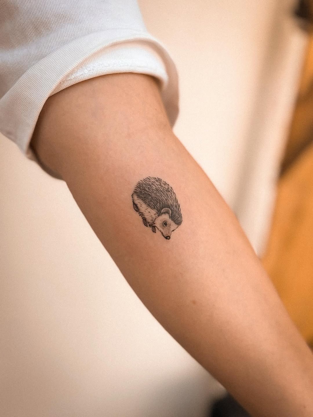 Charming hedgehog tattoo on a forearm Tattoo Design