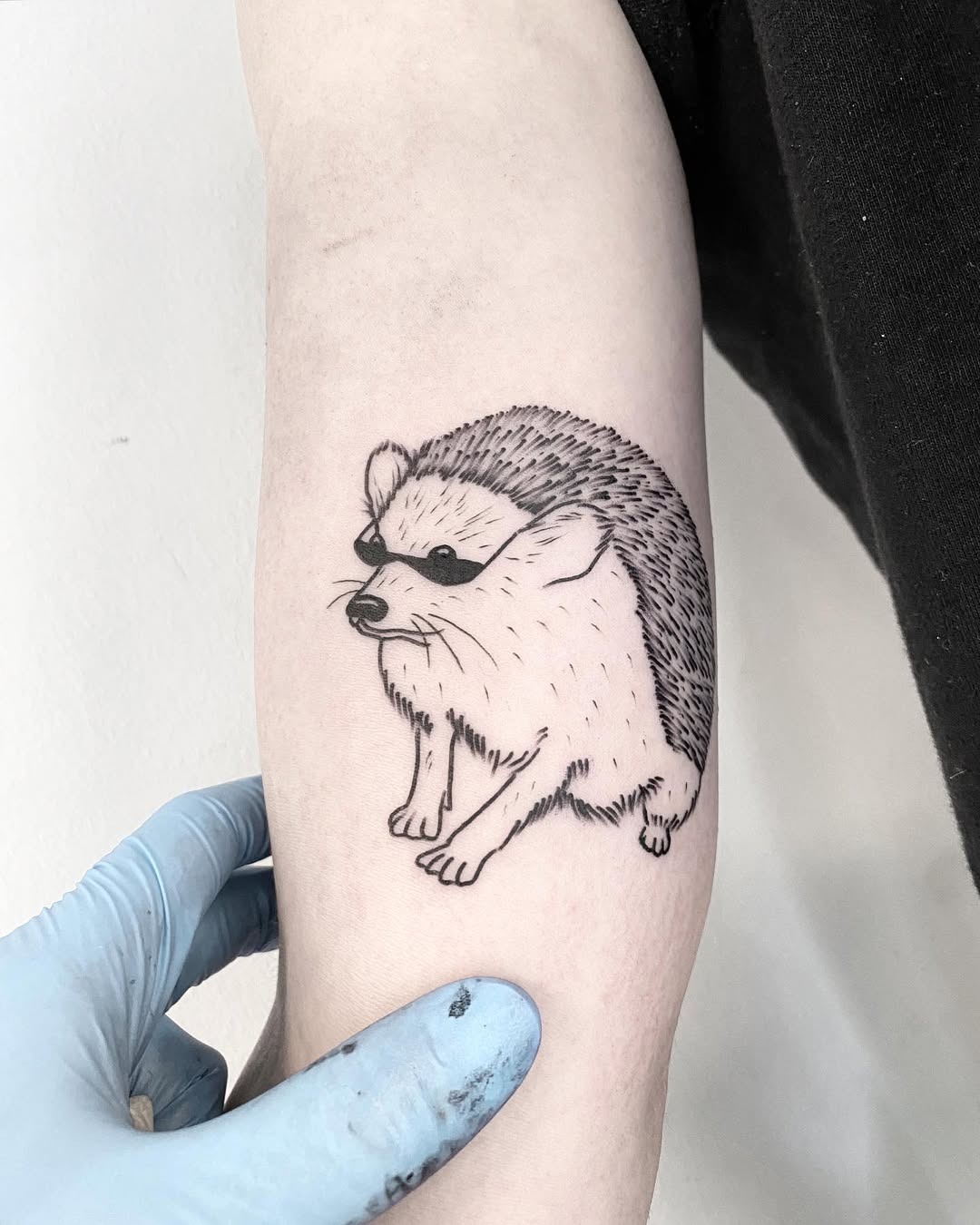 Charming hedgehog tattoo with cute design elements Tattoo Design