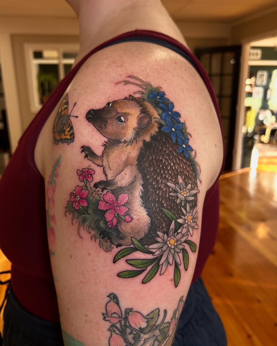 Charming hedgehog tattoo with floral elements Tattoo Design