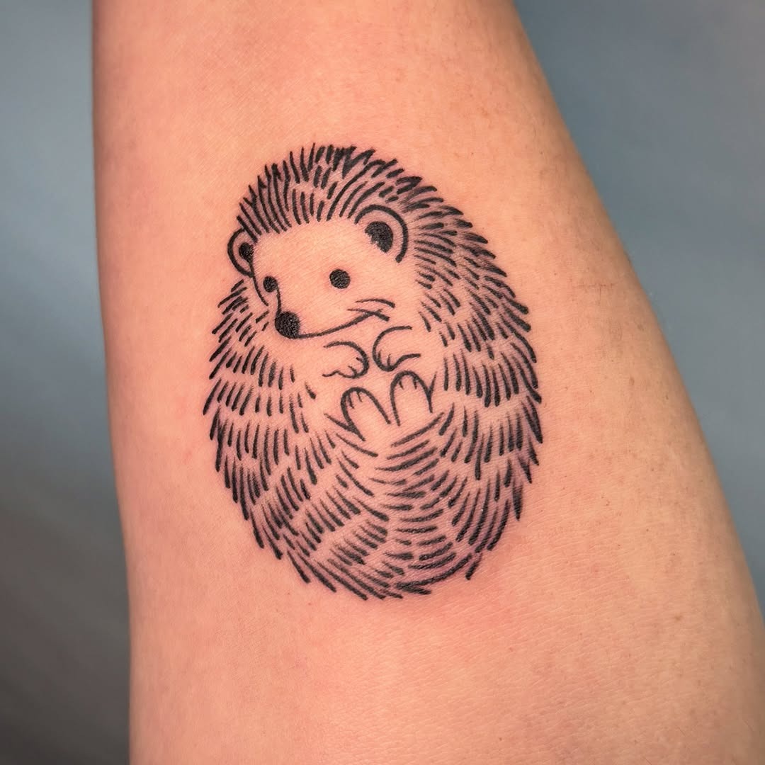 Charming hedgehog tattoo with intricate details Tattoo Design