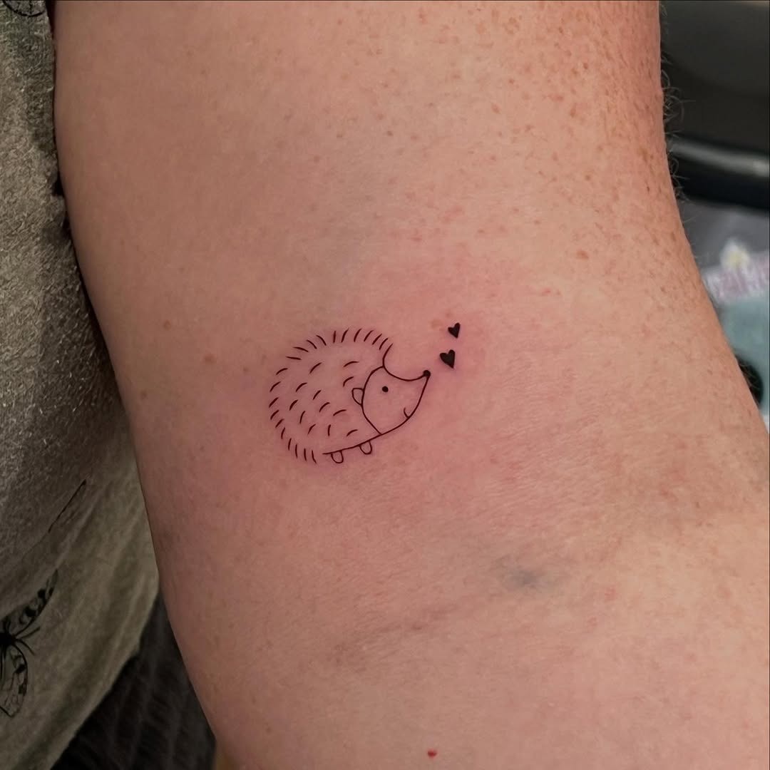 Charming hedgehog tattoo with love hearts Tattoo Design