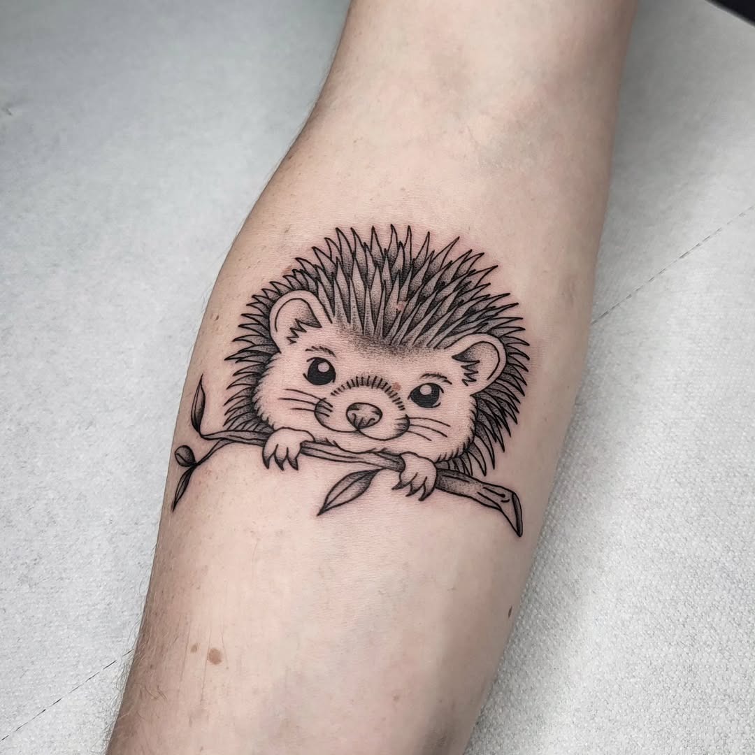 Charming hedgehog tattoo with natural elements Tattoo Design