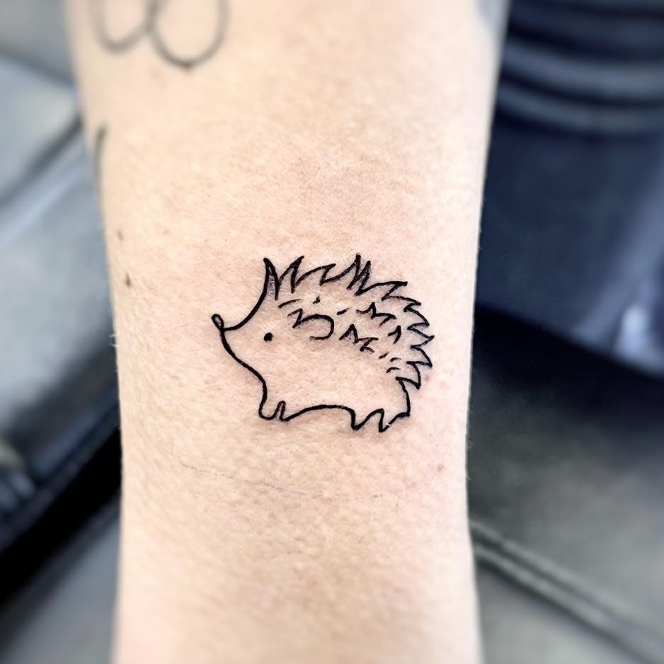 Charming minimalist hedgehog tattoo design Tattoo Design