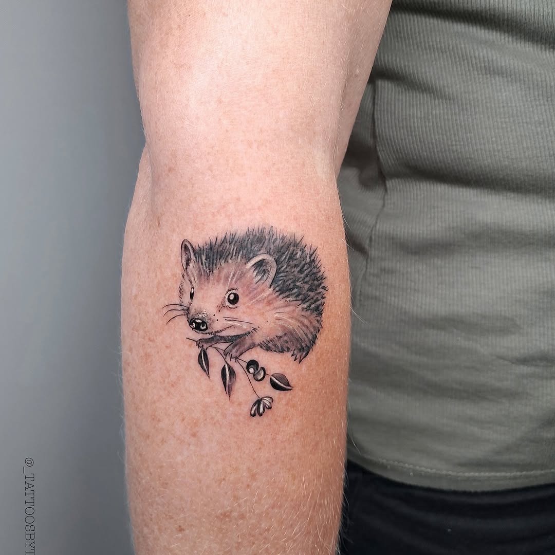 Cute hedgehog tattoo embracing nature's charm Tattoo Design