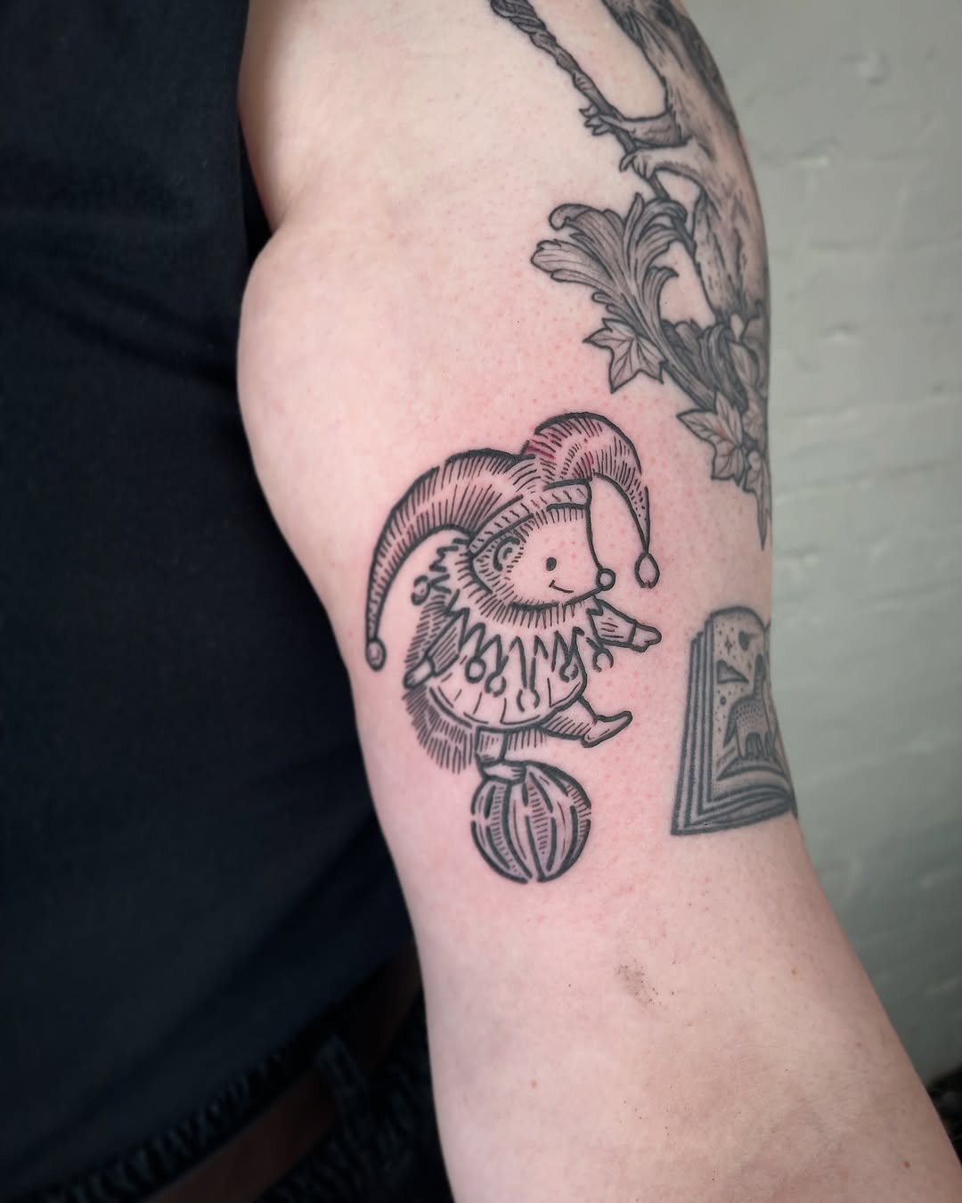 Playful hedgehog clown tattoo design Tattoo Design