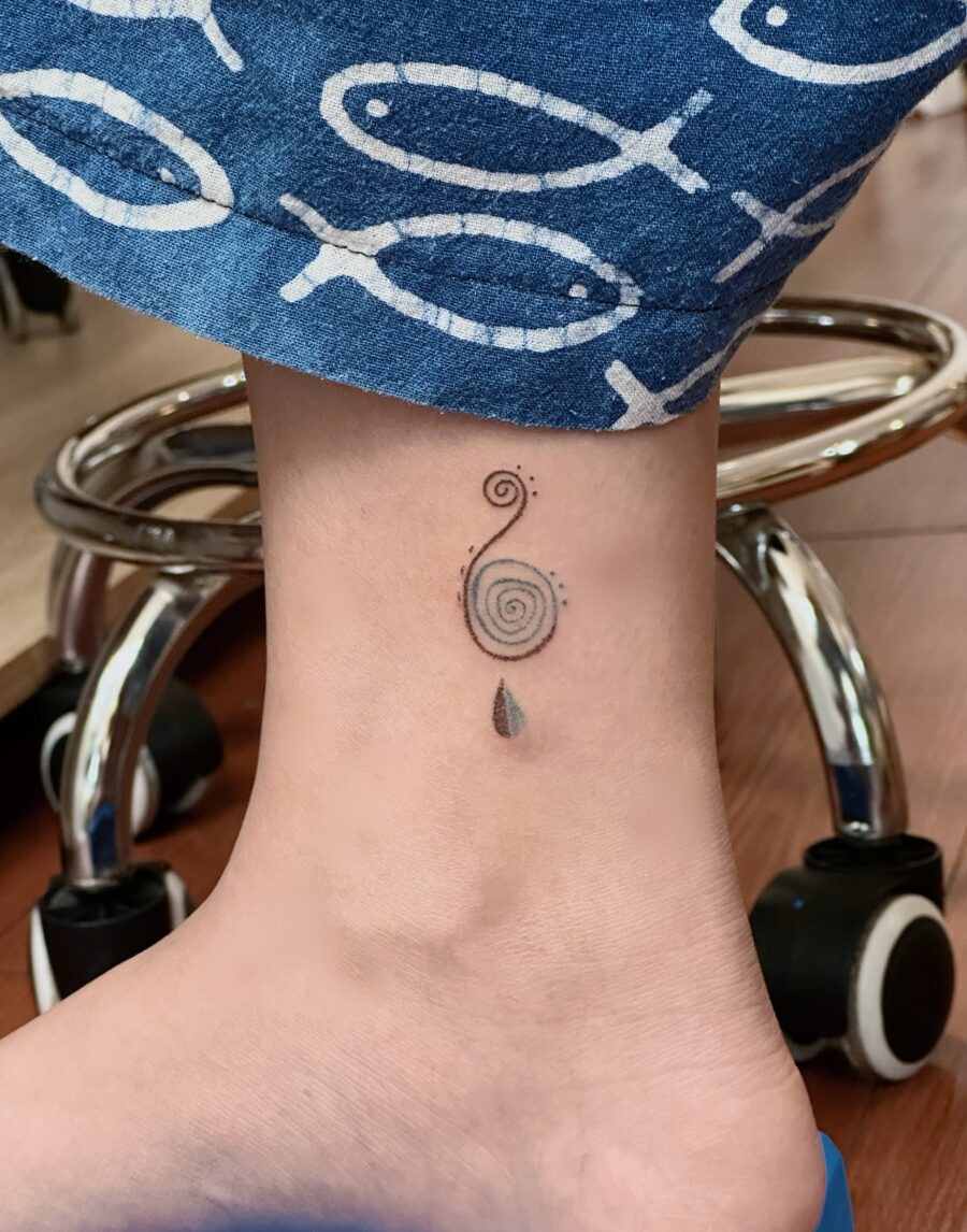 A captivating spiral tattoo on the ankle. Tattoo Design