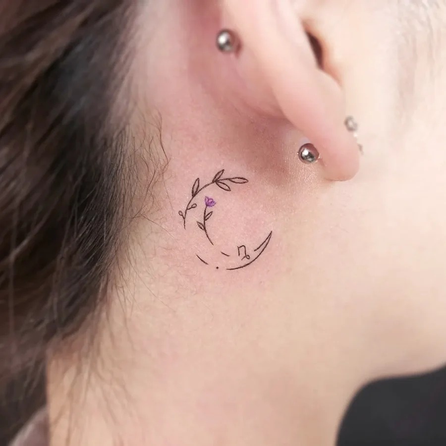 Delicate floral tattoo behind the ear Tattoo Design