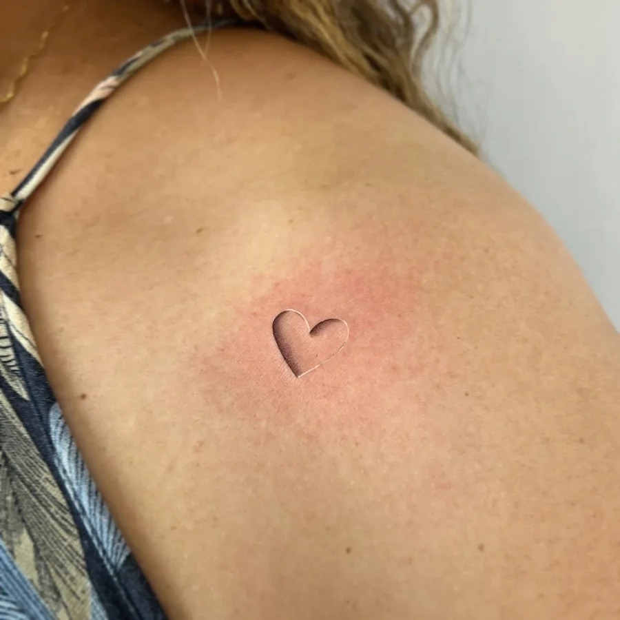 Delicate heart hidden tattoo on skin Tattoo Design