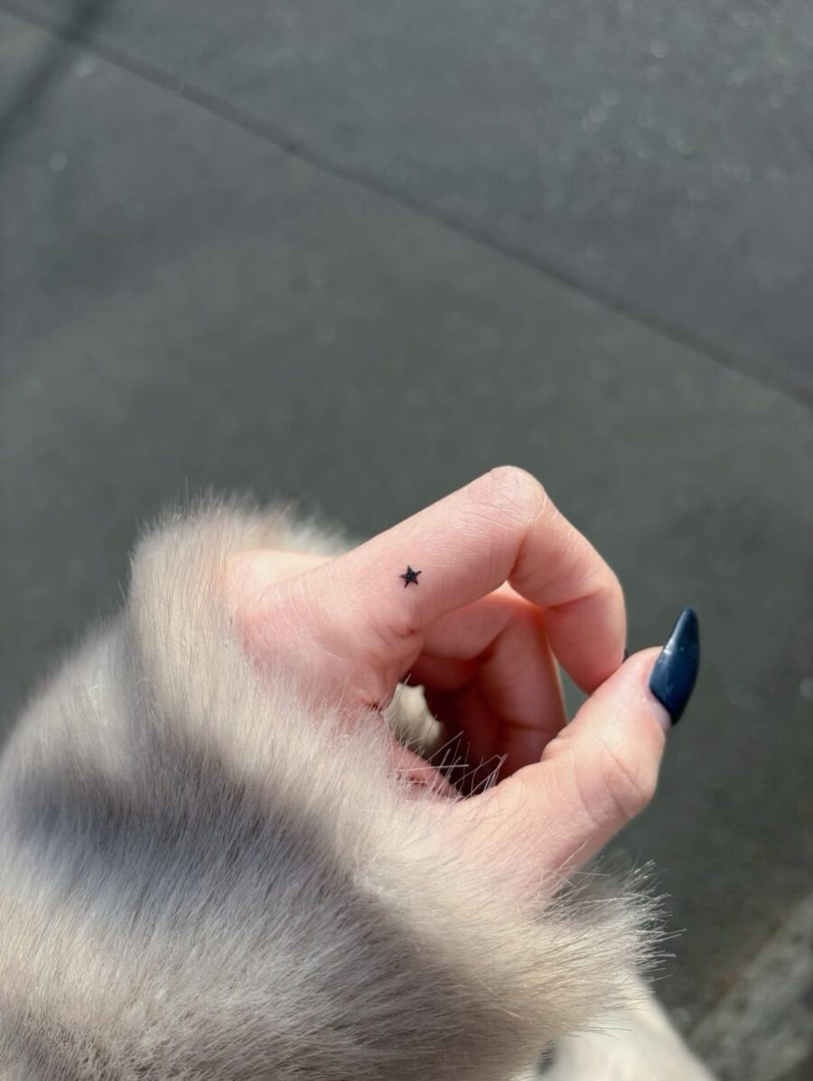 Delicate star tattoo hidden on the hand Tattoo Design