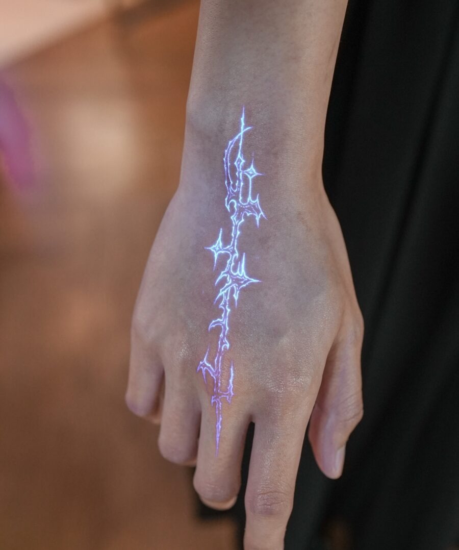 Electric blue hidden tattoo on hand Tattoo Design