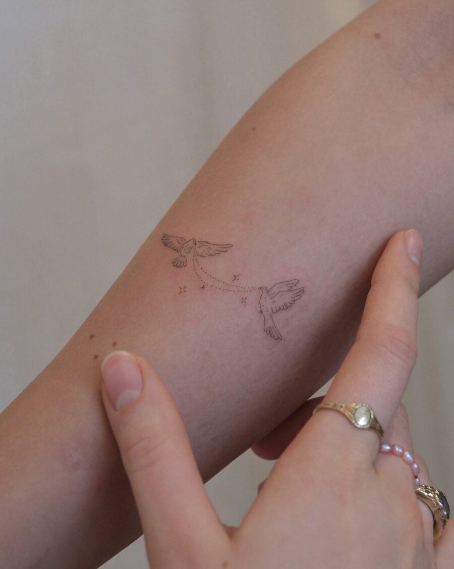 Elegant birds in subtle flight tattoo design Tattoo Design