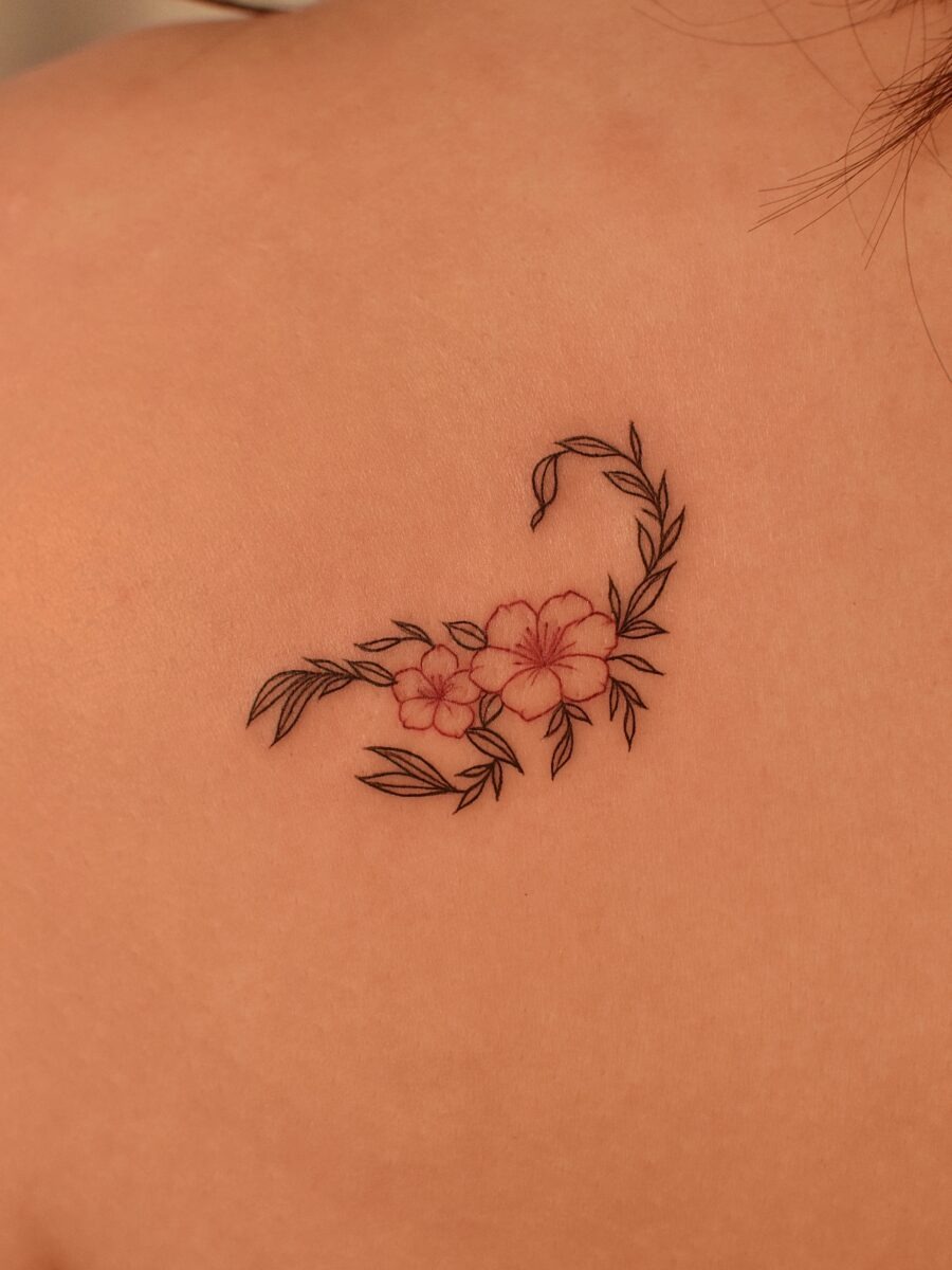 Elegant floral swan tattoo on the back Tattoo Design