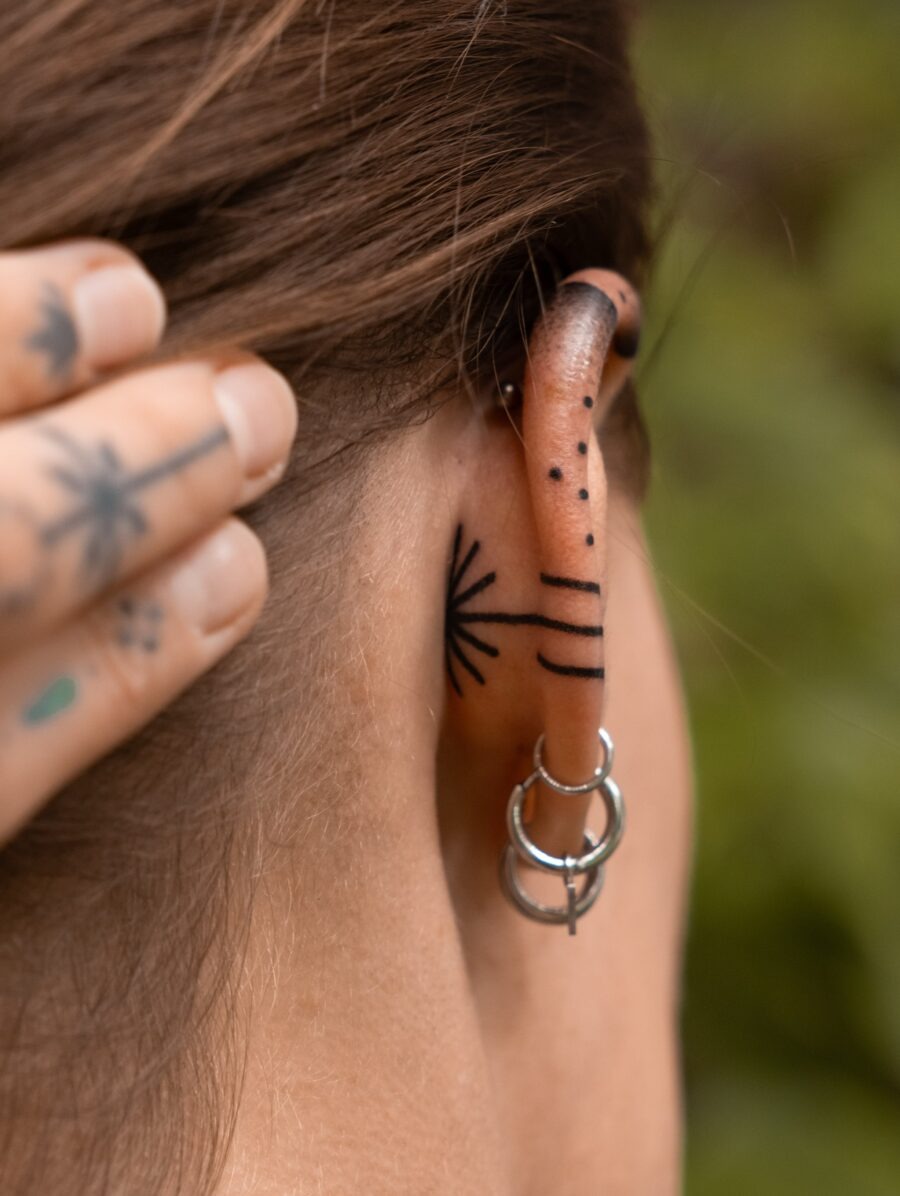 Elegant subtlety in ear tattoo designs Tattoo Design