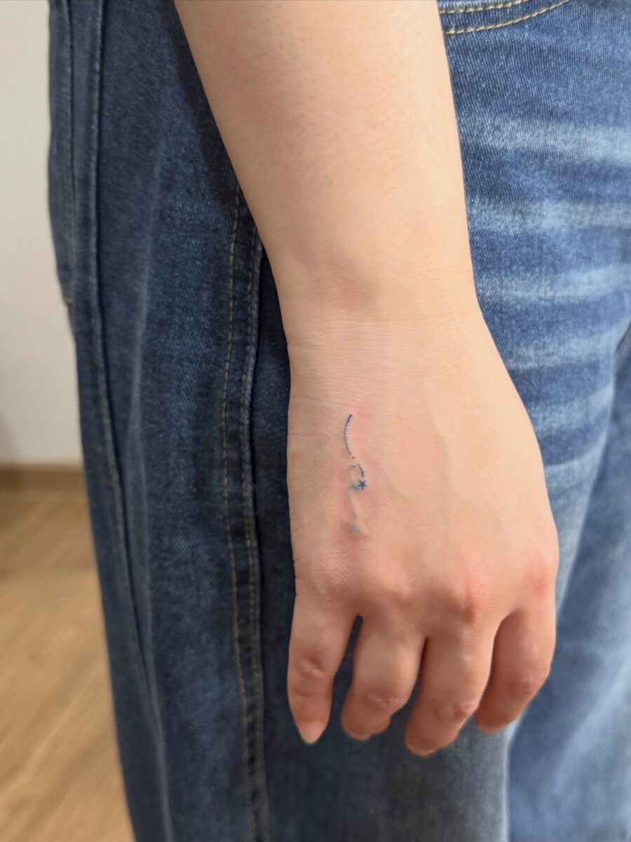 Subtle artistry on the wrist revealed here Tattoo Design