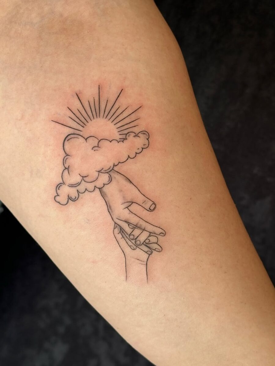 A unique tattoo of hands and clouds. Tattoo Design