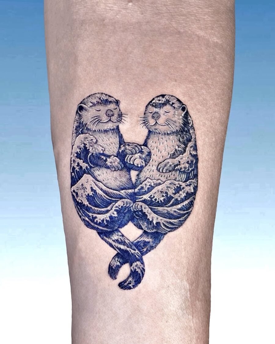 Charming otters symbolize love and connection Tattoo Design