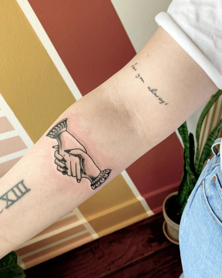 Elegant Holding Hands Tattoo on Forearm Tattoo Design