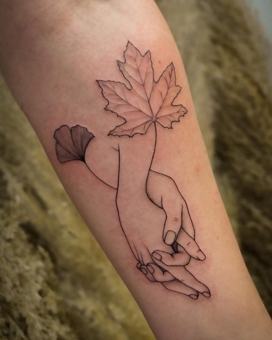 Elegant holding hands with a nature touch Tattoo Design