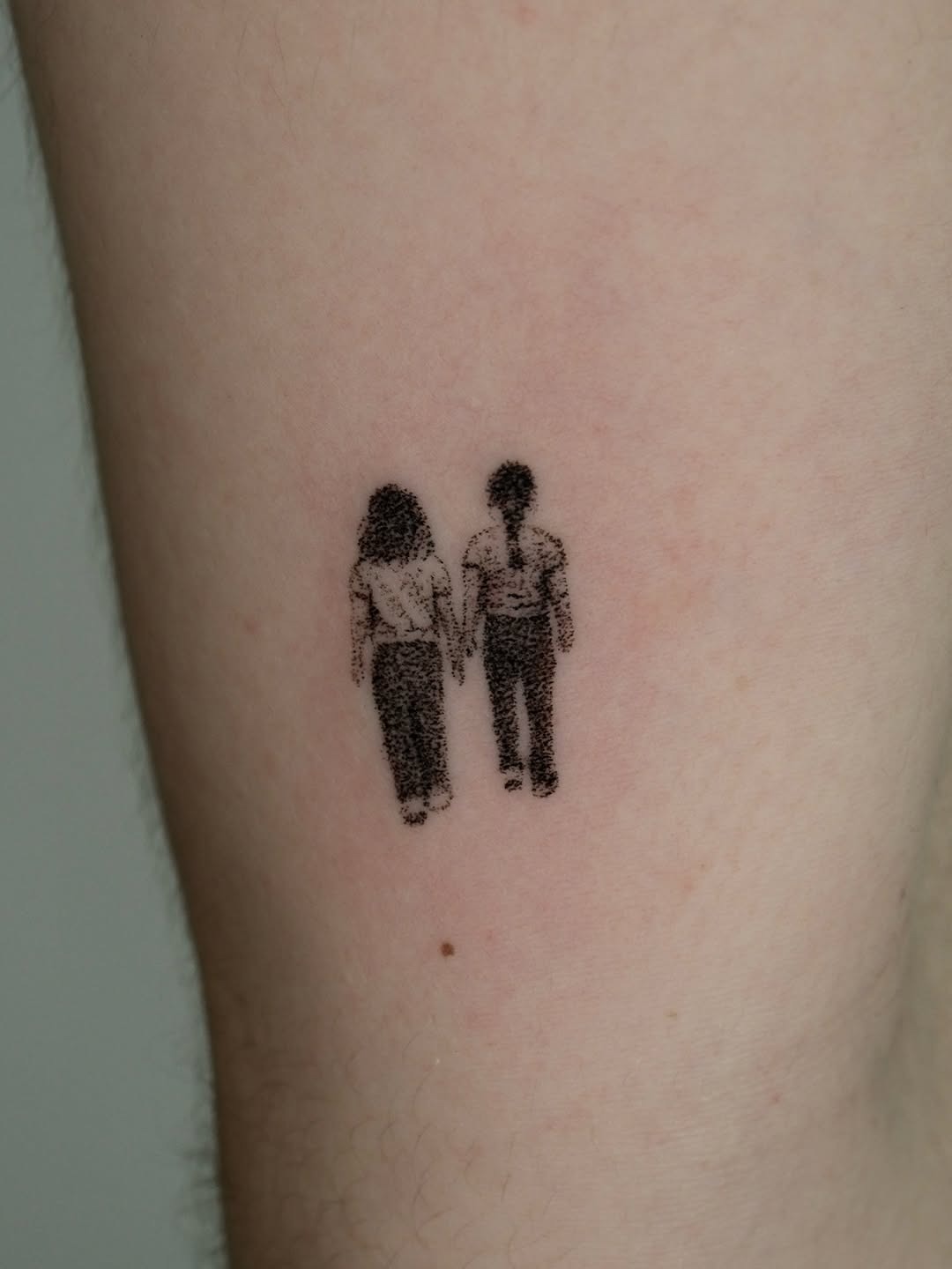 Minimalist holding hands tattoo showcasing connection Tattoo Design