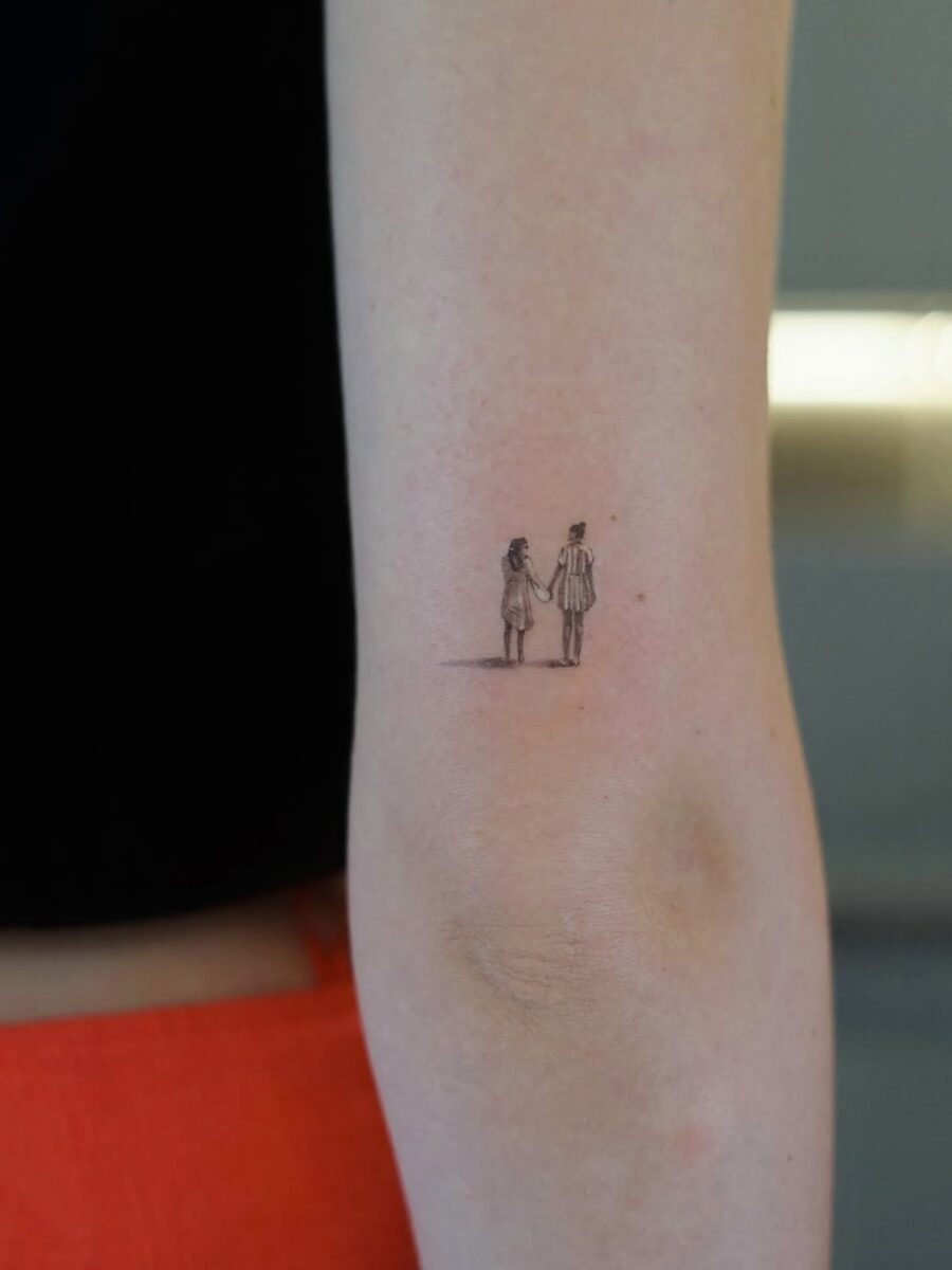 Minimalist Holding Hands Tattoo Symbolizing Love Tattoo Design