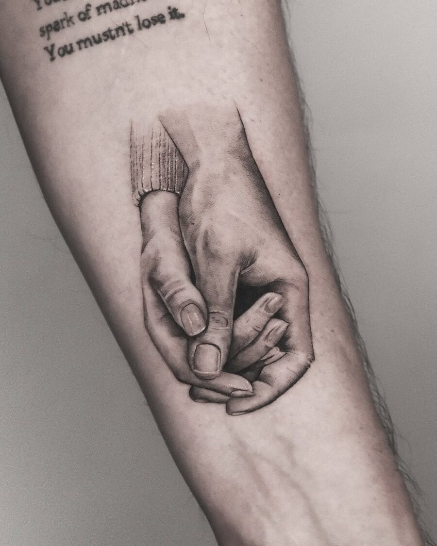 Realistic holding hands tattoo design inspiration Tattoo Design