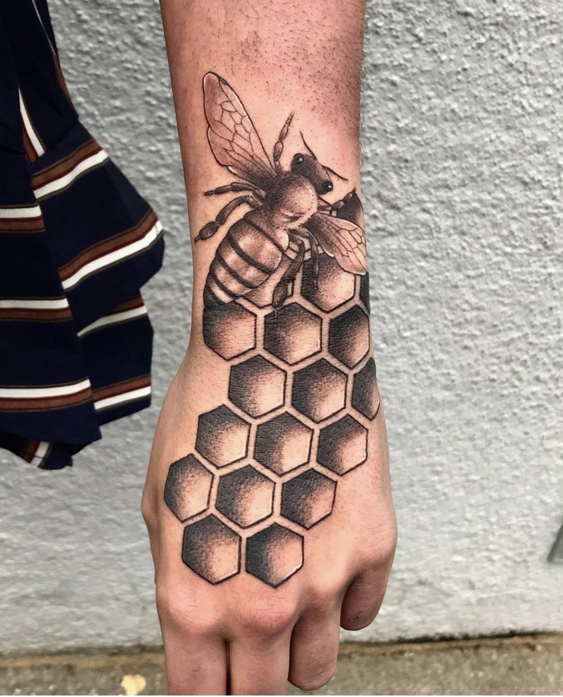 Simple Bee and Honeycomb on Arm Tattoo Design