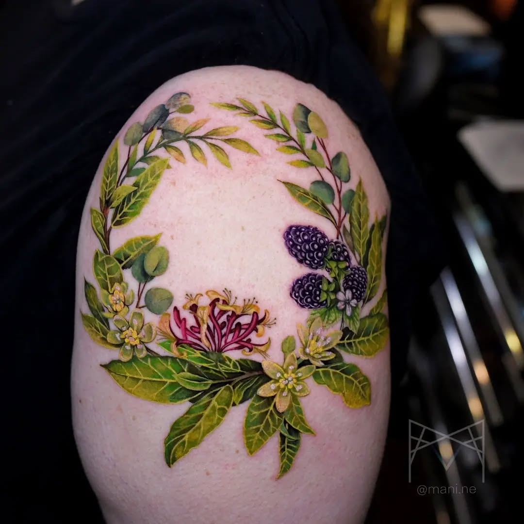This stunning honeysuckle tattoo features colors and intricate detailing.