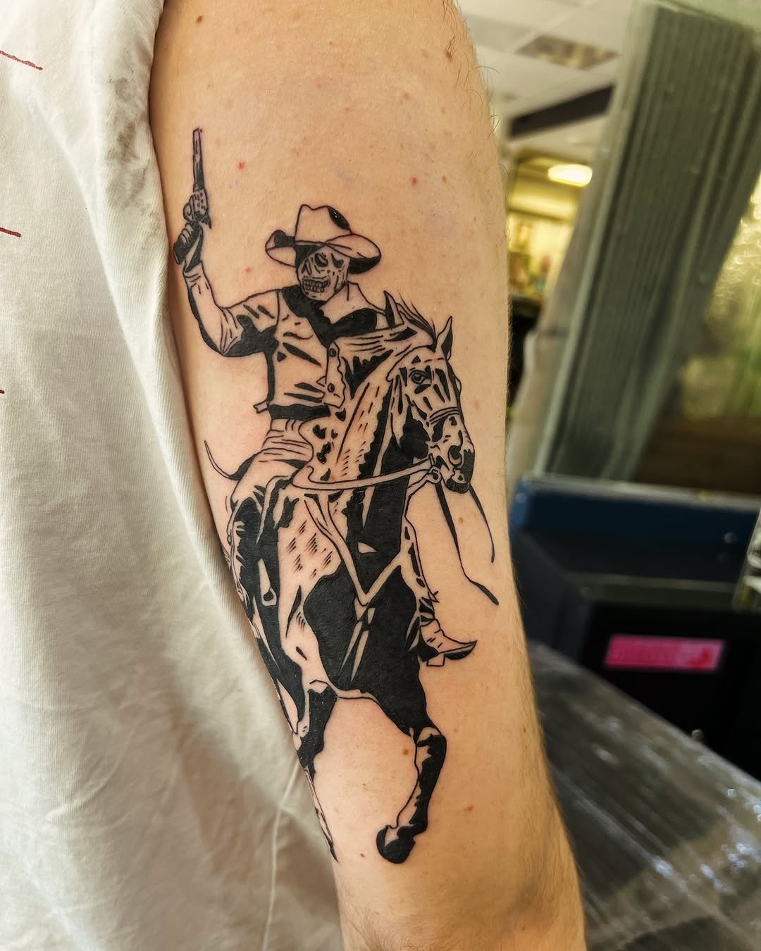Dynamic cowboy skeleton tattoo on horseback Tattoo Design