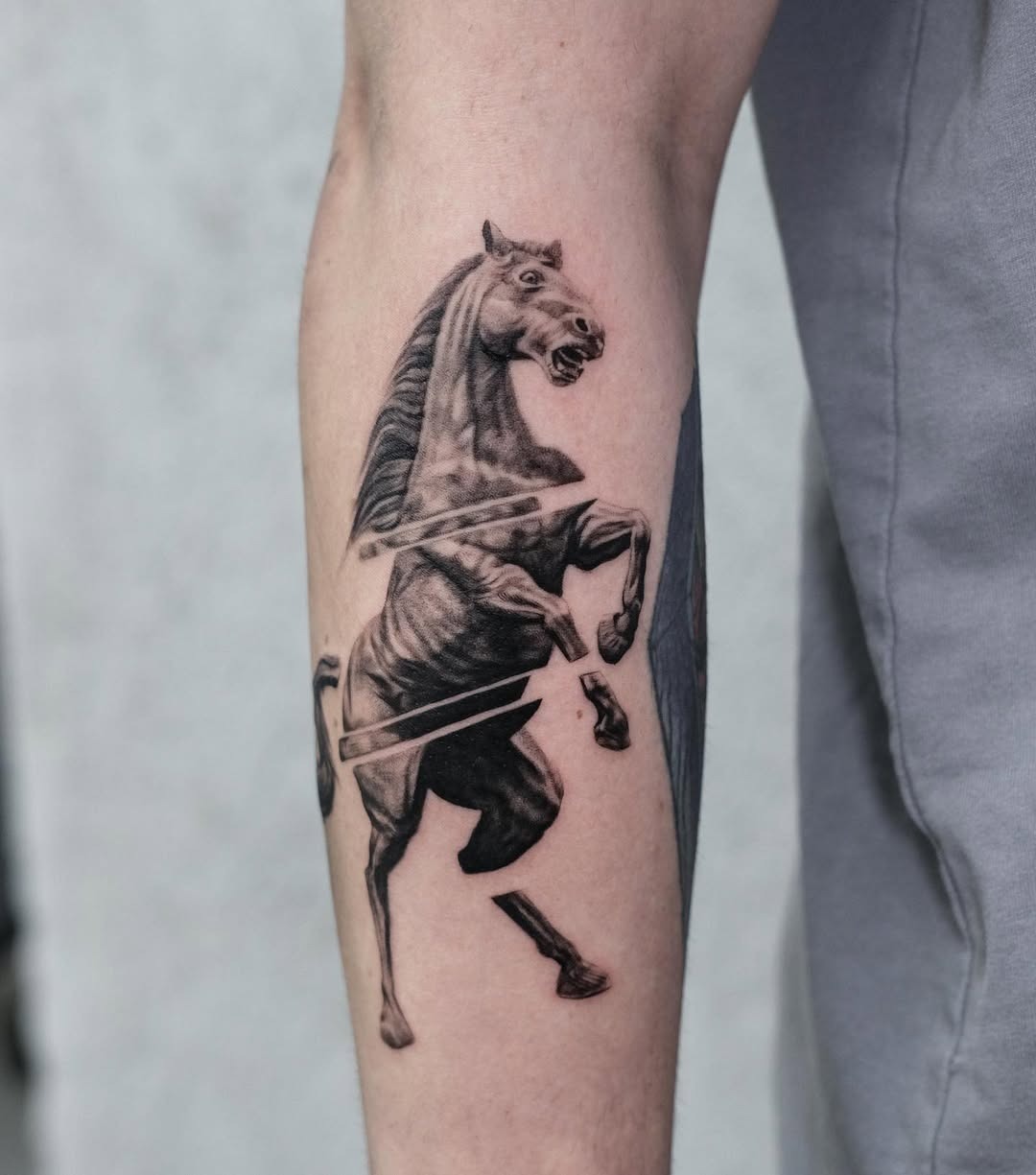 Dynamic horse tattoo with a fierce presence Tattoo Design