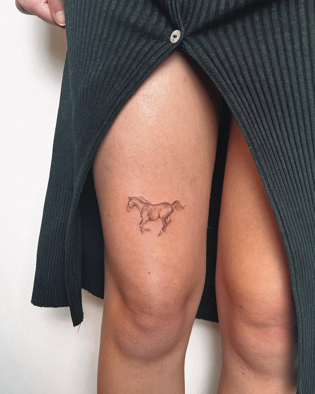 Elegant minimalist horse tattoo on thigh Tattoo Design