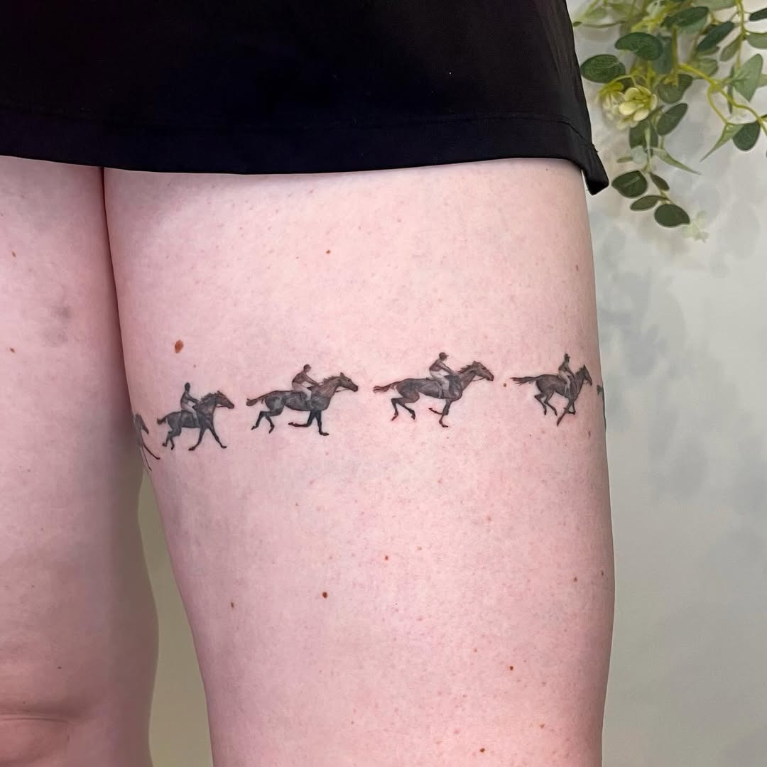 Flowing horse tattoo design on thigh Tattoo Design