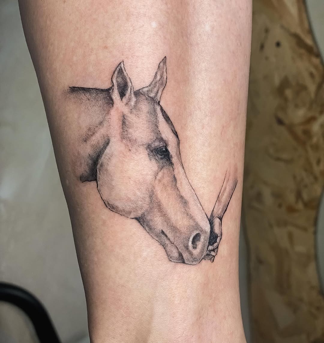 Stunning horse tattoo with a human touch Tattoo Design