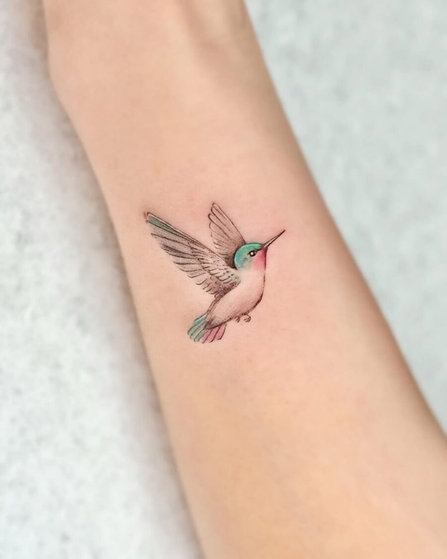 A vibrant hummingbird tattoo in flight Tattoo Design