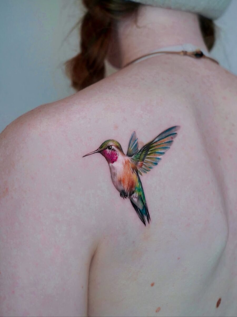 A vibrant hummingbird tattoo on the shoulder Tattoo Design
