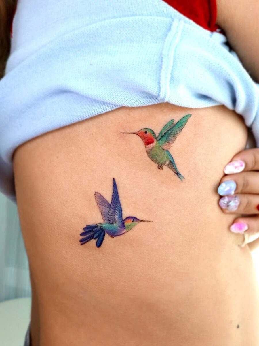 Colorful hummingbirds in delicate tattoo style Tattoo Design