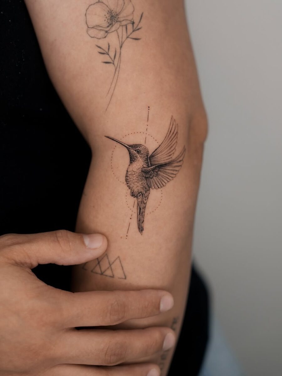 Delicate hummingbird tattoo captures graceful essence Tattoo Design