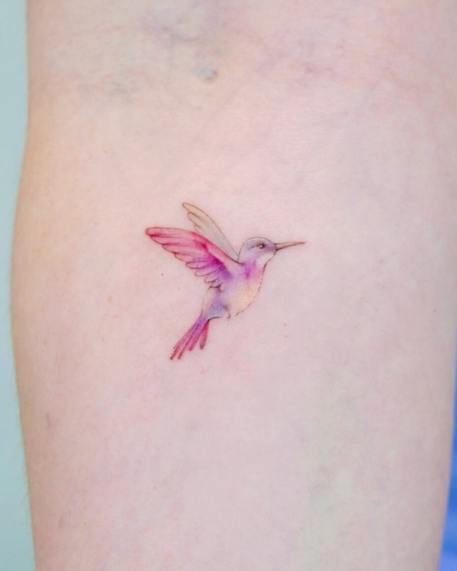 Delicate watercolor hummingbird tattoo on skin Tattoo Design