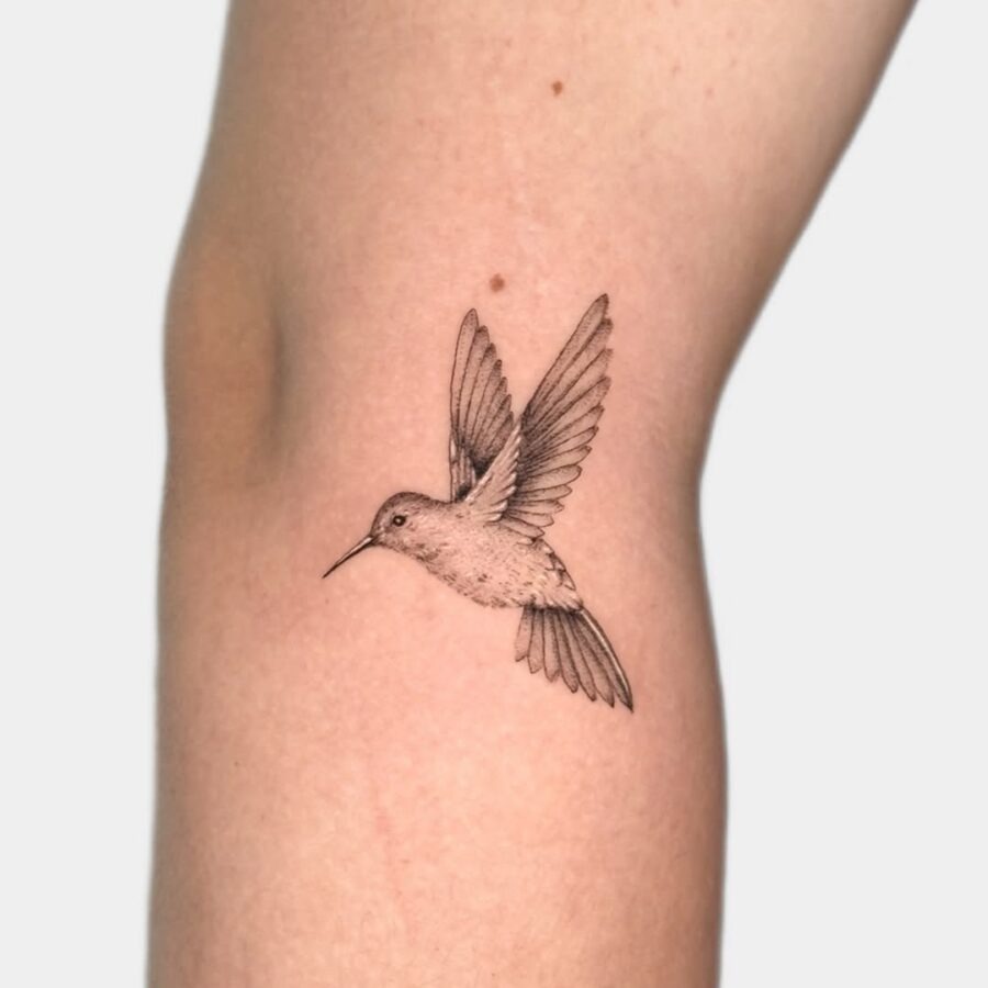 Elegant hummingbird in mid-flight tattoo Piece Tattoo Design