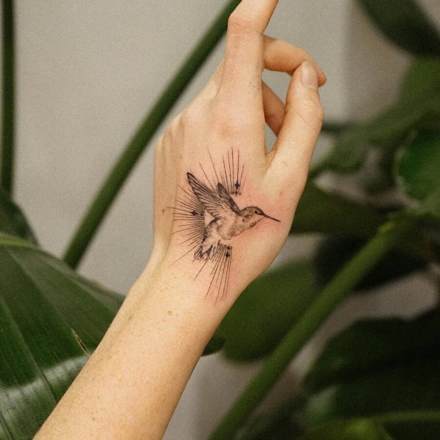 Elegant hummingbird tattoo on a hand Tattoo Design