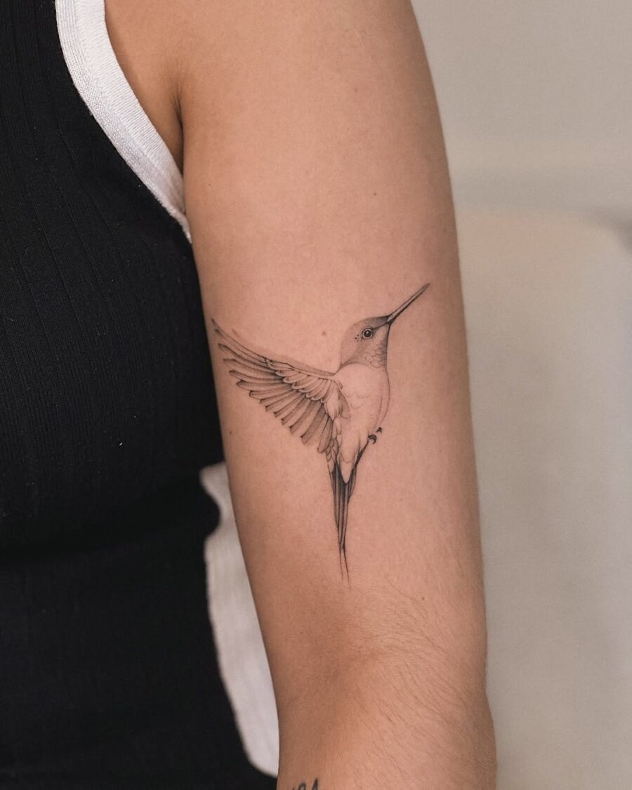Elegant hummingbird tattoo on arm Tattoo Design