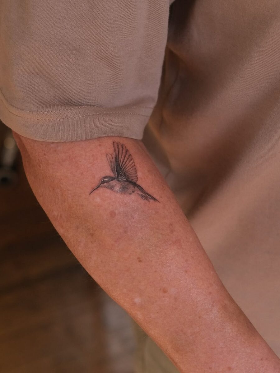 Elegant hummingbird tattoo on forearm Tattoo Design