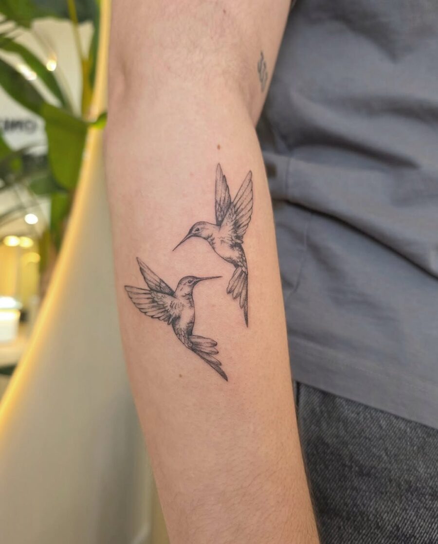 Elegant hummingbirds in graceful flight. Tattoo Design