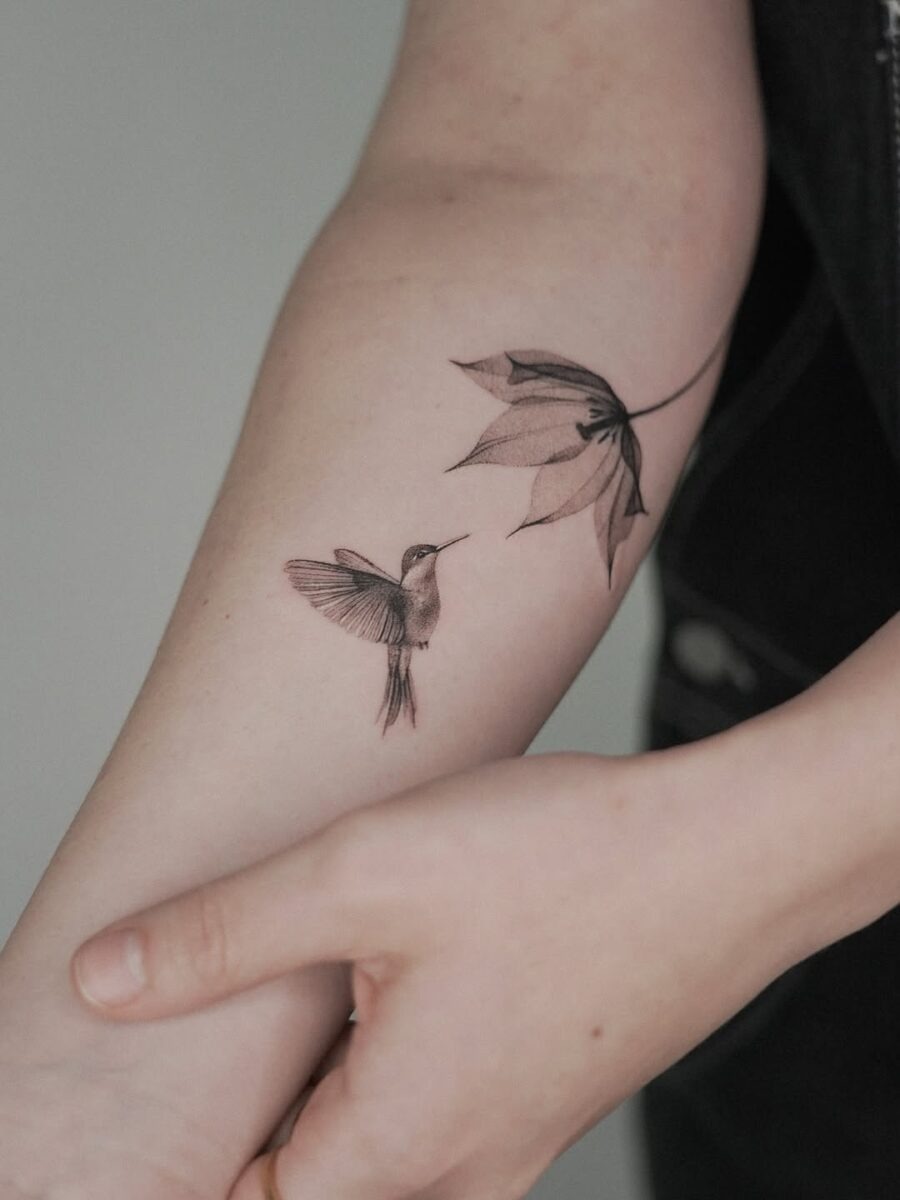 Graceful hummingbird and floral tattoo design Tattoo Design