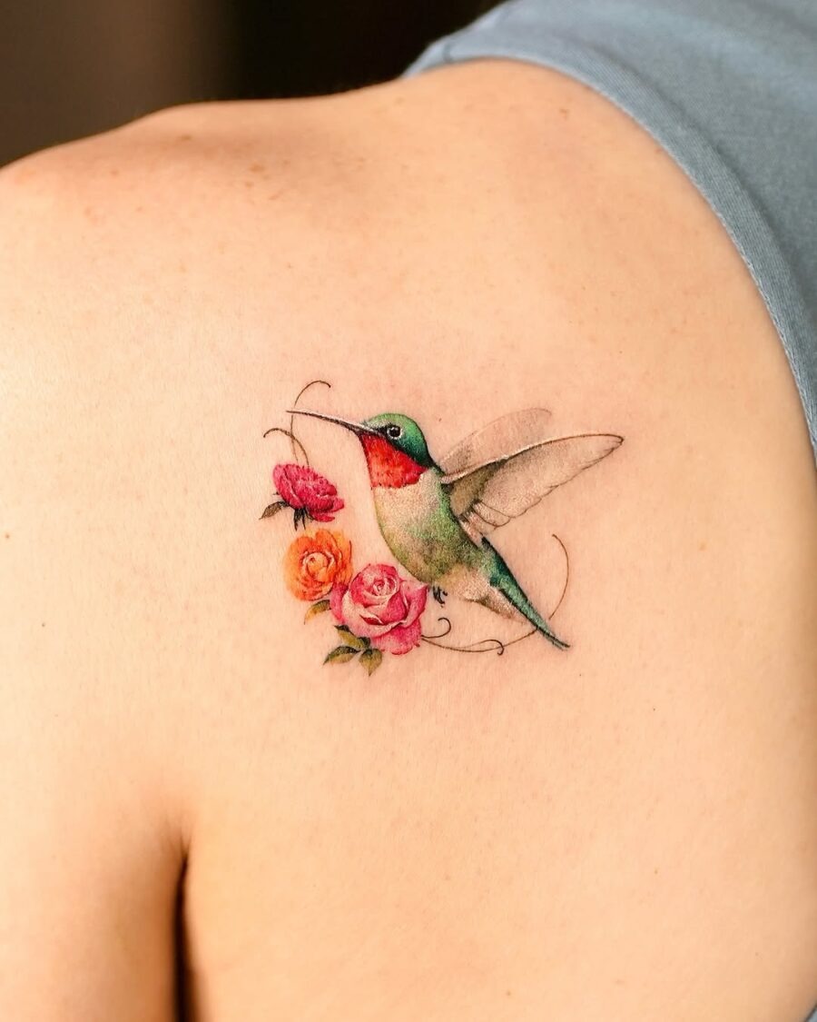 Intricate hummingbird tattoo with blooming roses Tattoo Design