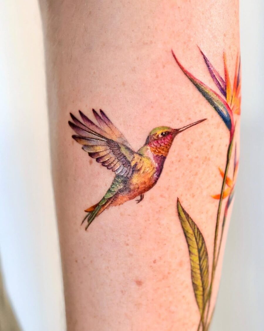 Stunning colorful hummingbird with floral accents Tattoo Design