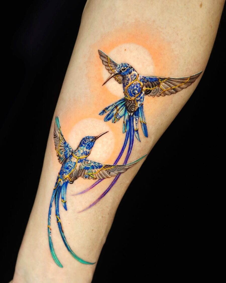 Stunning vibrant hummingbirds in dynamic flight Tattoo Design