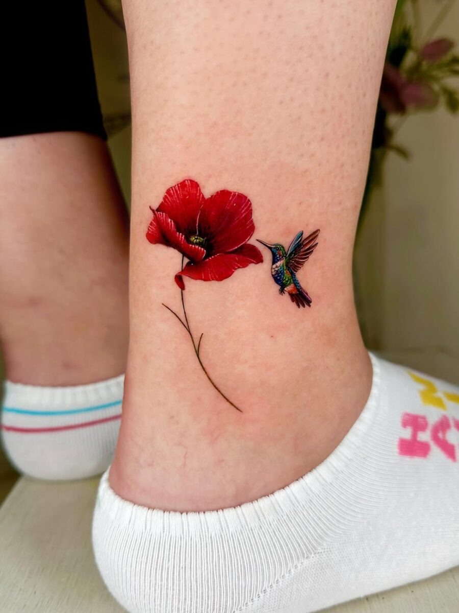 Vibrant hummingbird alongside a gorgeous flower Tattoo Design