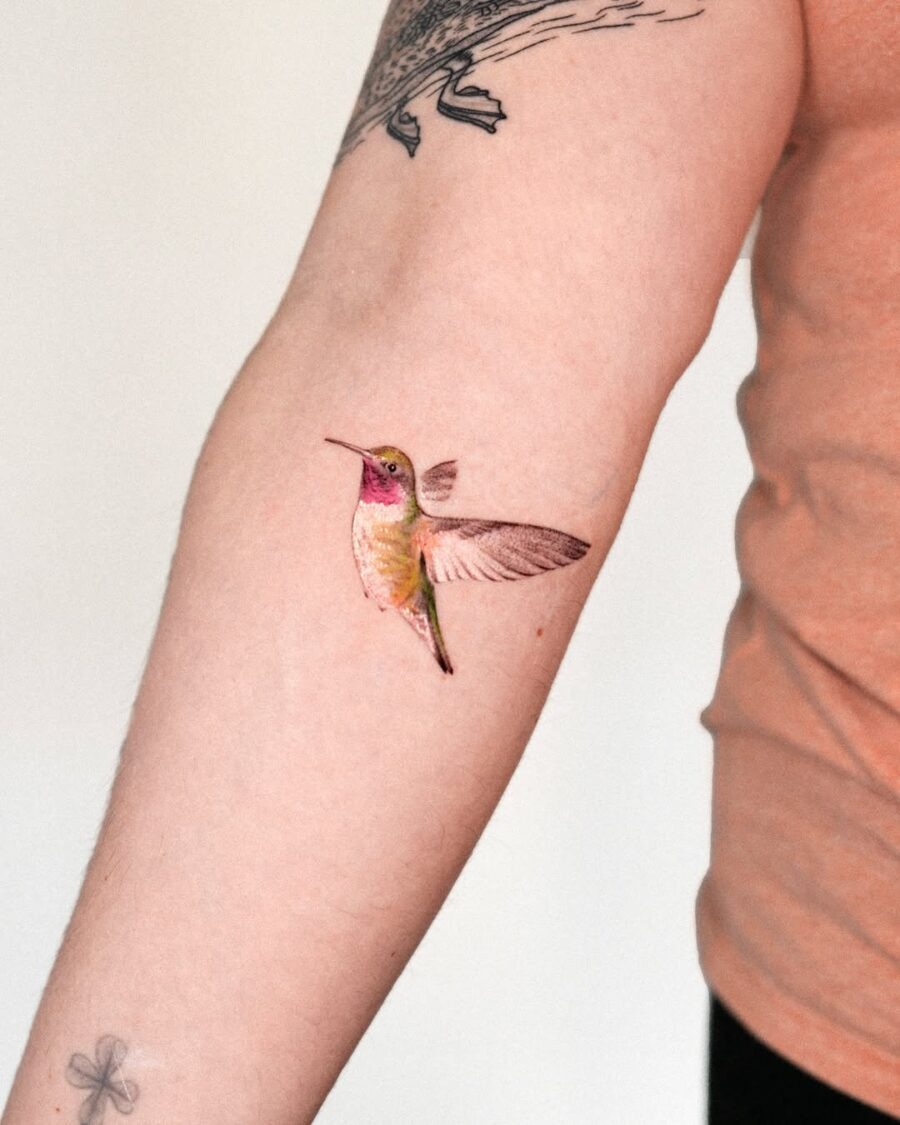 Vibrant hummingbird tattoo showcasing intricate details Tattoo Design