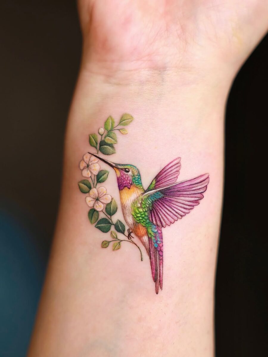 Vibrant Hummingbird Tattoo with Blossoms Tattoo Design